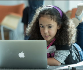 girl with Apple laptop